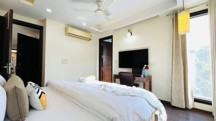 What is the Minimum Stay Duration at Olive Service Apartments in Delhi?